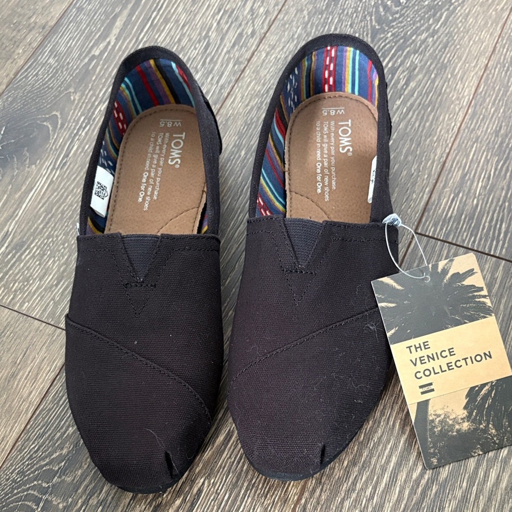 TOMS Black Canvas Women’s Slip-On Flats with Striped Lining